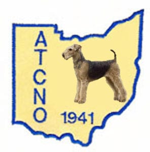 Illustration of a gray dog standing in the center of a yellow map outline of ohio with the text "atcno 1941" inside.