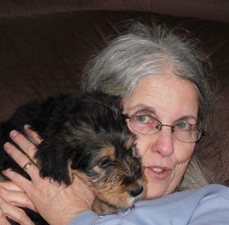 An old woman carrying a young Merry