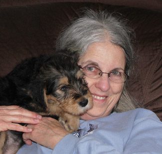 A smiling old woman carrying Merry