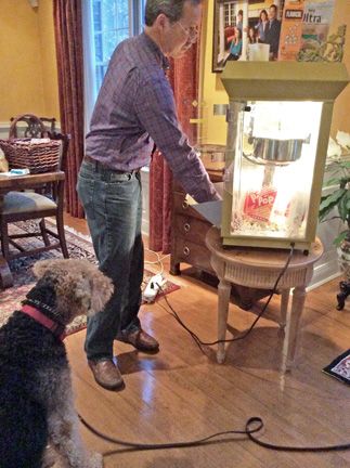 Bingley looking at the popcorn machine