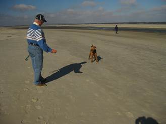 Bixby at the beach with an old man